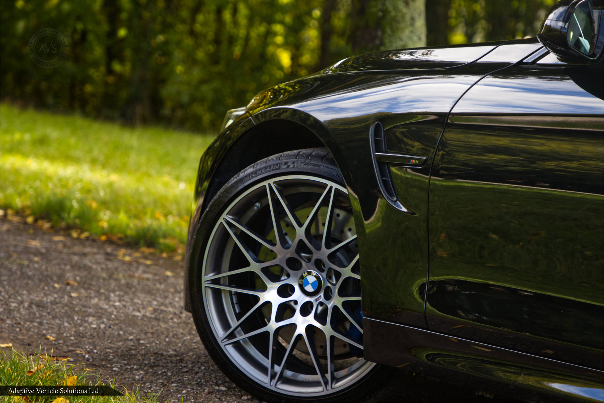 BMW M4 Competition black coupe competition wheels and fender