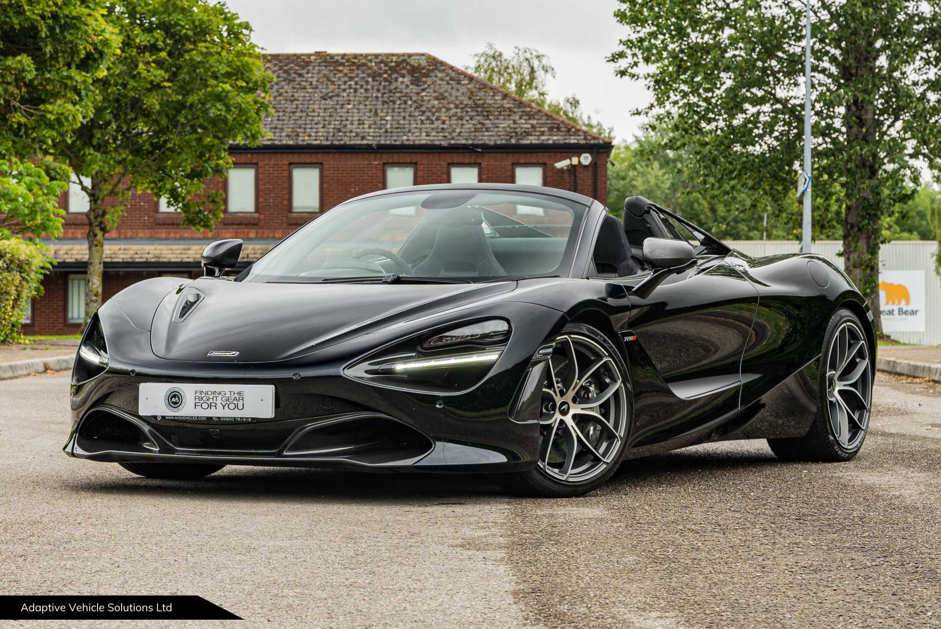 2021 McLaren 720s Spider Performance Black near side front view roof open