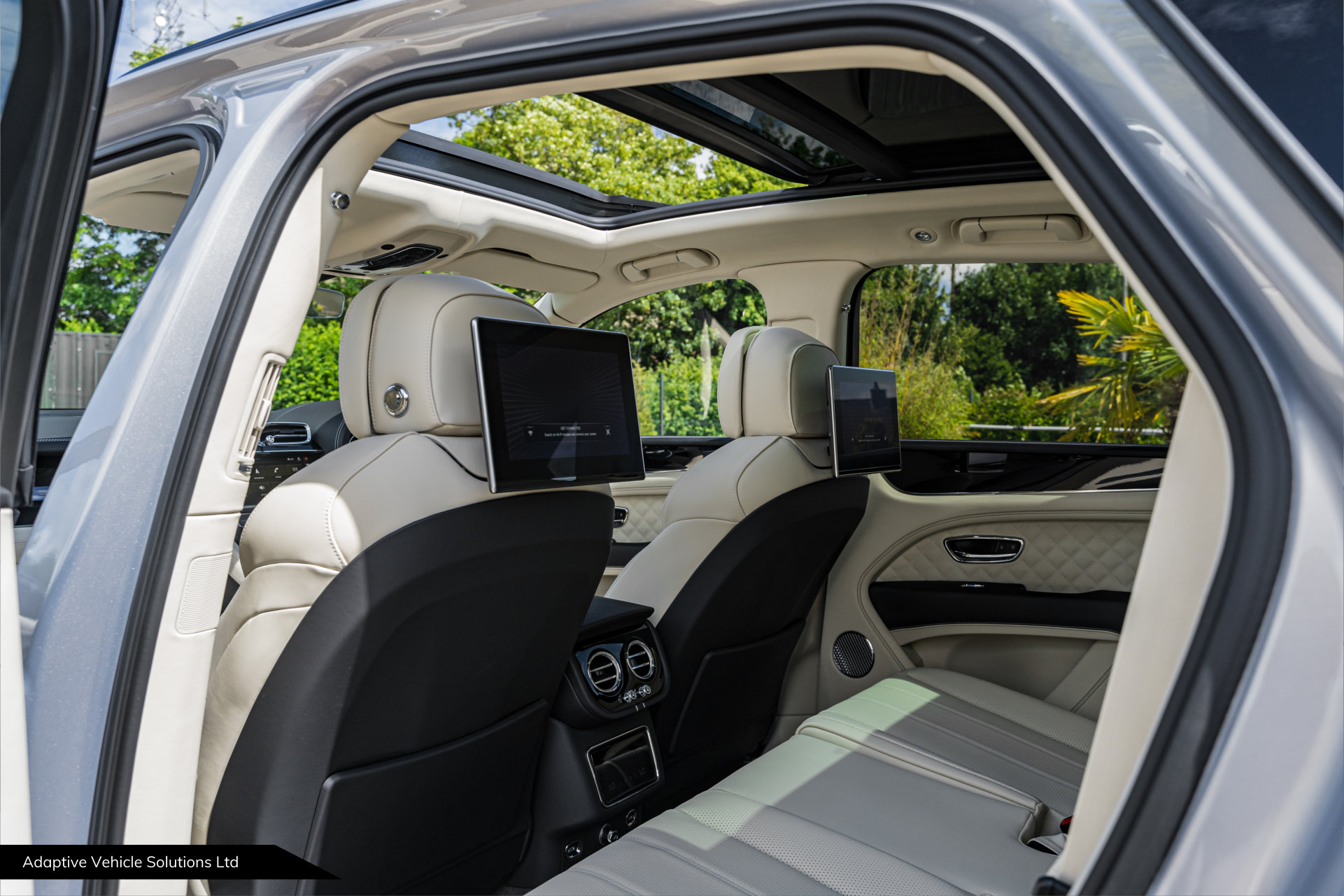 2022 Bentley Bentayga S V8 Extreme Silver rear seat view with entertainment