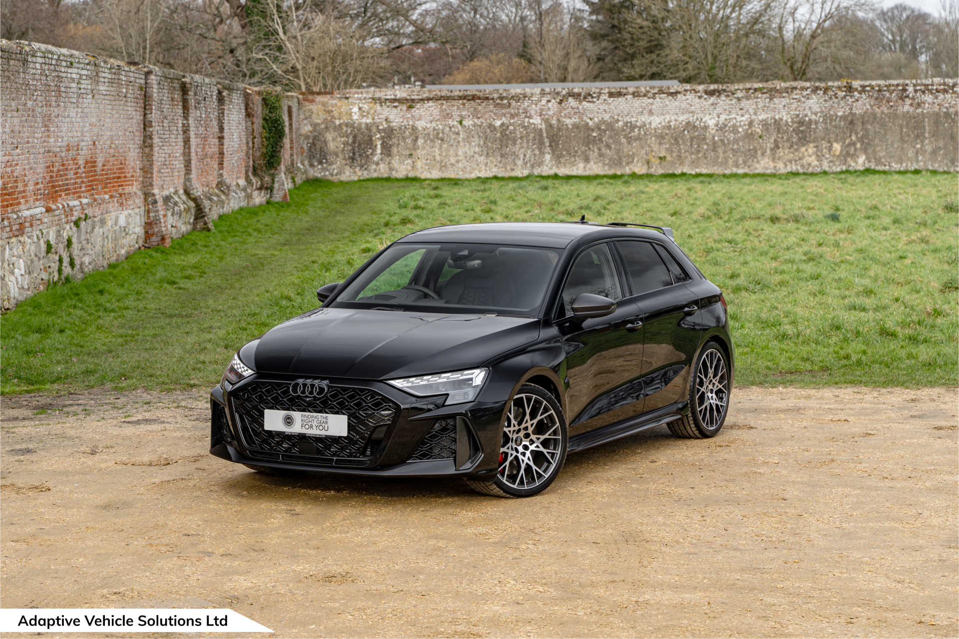 2025MY Audi RS3 Carbon Vorsprung Sportback Mythos Black 01 Header An image of the spirit of ecstasy from a Rolls Royce Wraith Black Badge for the testimonial page